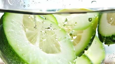 close-up of lemon slices in a glass of water