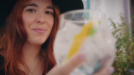 girl-relaxes-on-a-bar-terrace-and-drinks-a-gin