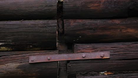 old wooden wall with metal strap
