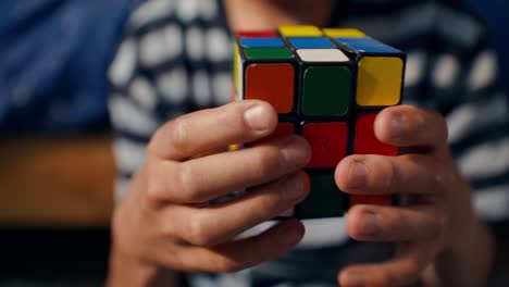 person solving a rubik's cube