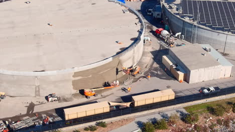 using shotcrete or sprayed concrete to repair a water storage tank - aerial parallax