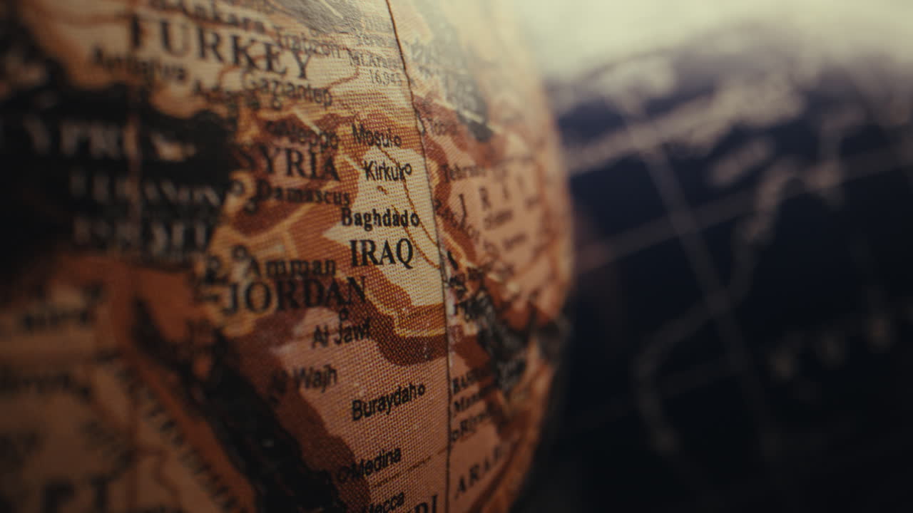 Close-up of a vintage world globe, focusing on Middle East