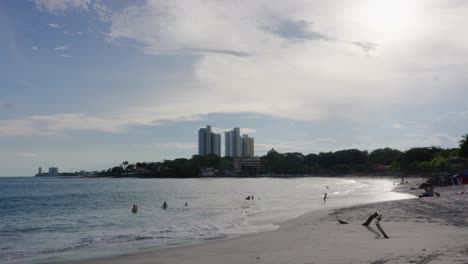 Beach-with-a-few-people-and-families-having-fun