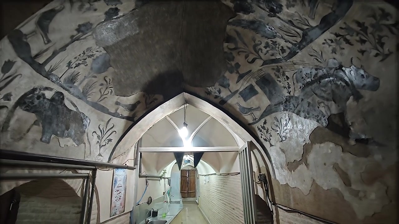 Interior View of an Ancient Vaulted Corridor with Traditional Wall Paintings
