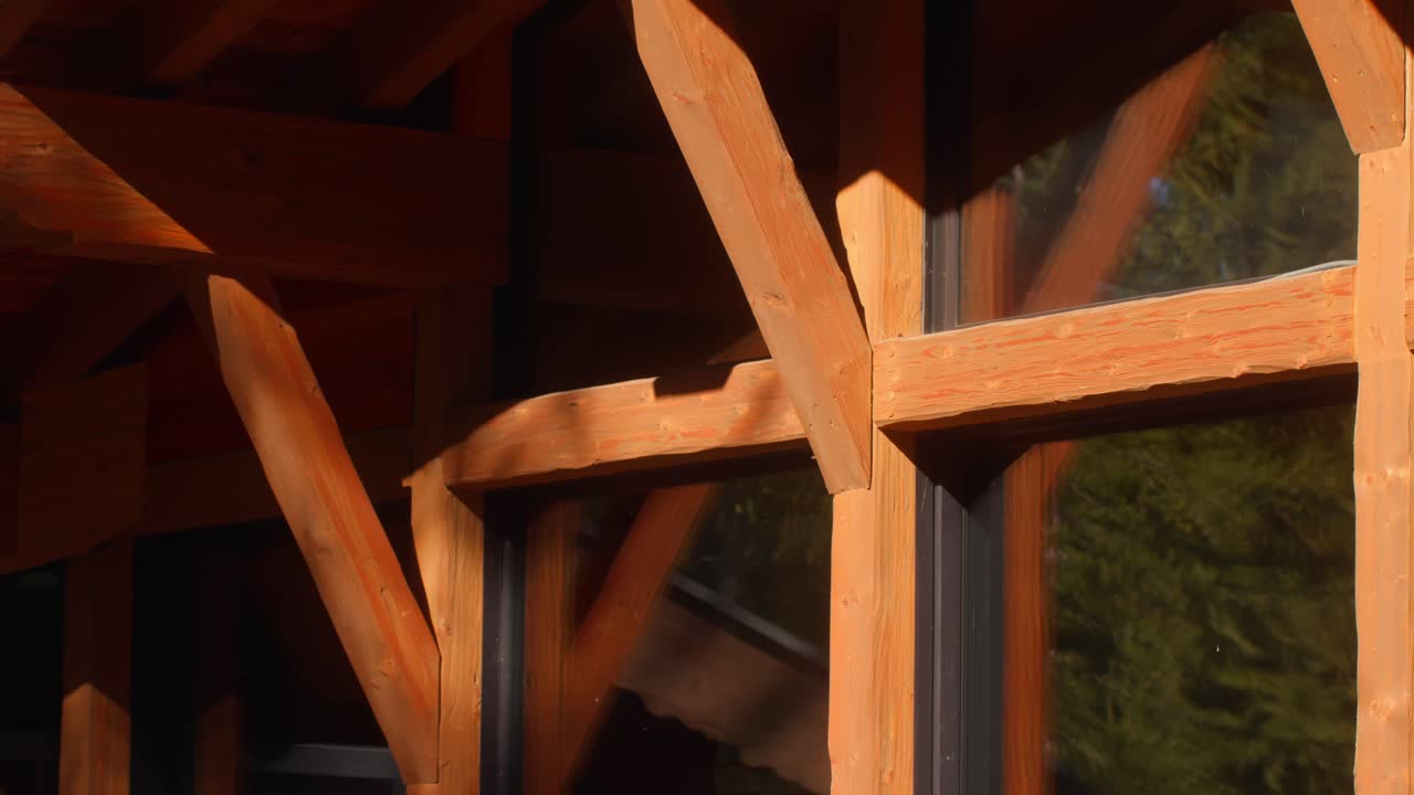 Closeup of wood and windows being hit by sunlight in North Italy Italia giving a warm alpine vibe natural atmosphere