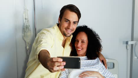 Couple-taking-selfie-on-mobile-phone-in-ward