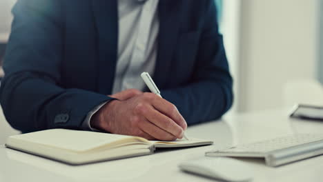 Businessman,-hands-and-writing-in-book