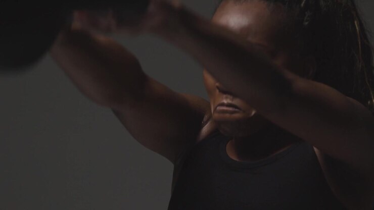 Studio Shot Of Woman Wearing Gym Fitness Clothing Exercising With Kettlebell Weights 2