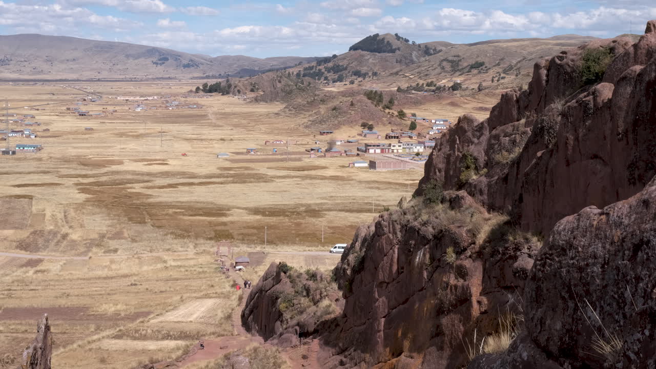 Unique rock formations and expansive landscape at the entrance to the mystical Aramu Muru archaeological site in Peru