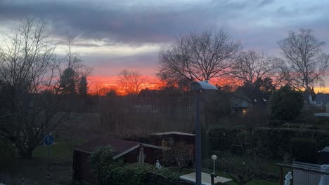 Beautiful-timelapse-of-a-glowing-sky-over-a-housing-development-with-bright-clouds