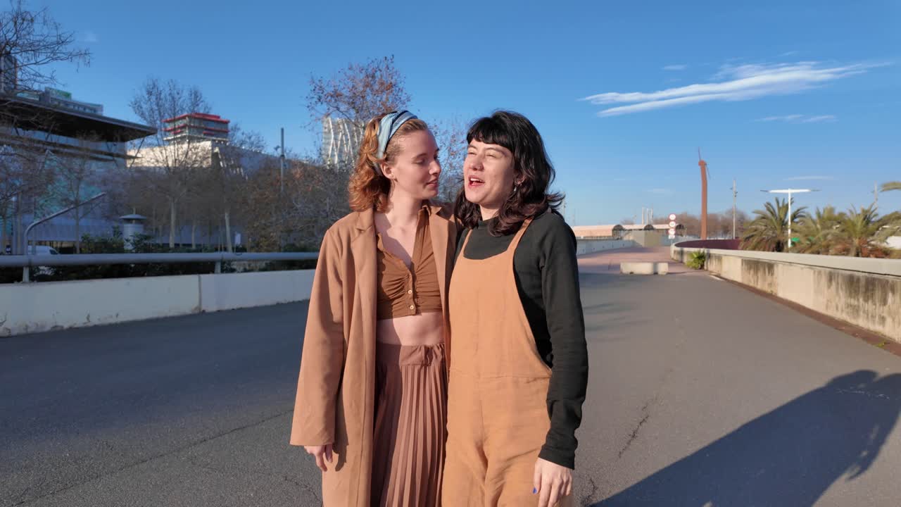 Two women enjoying a sunny day in the city
