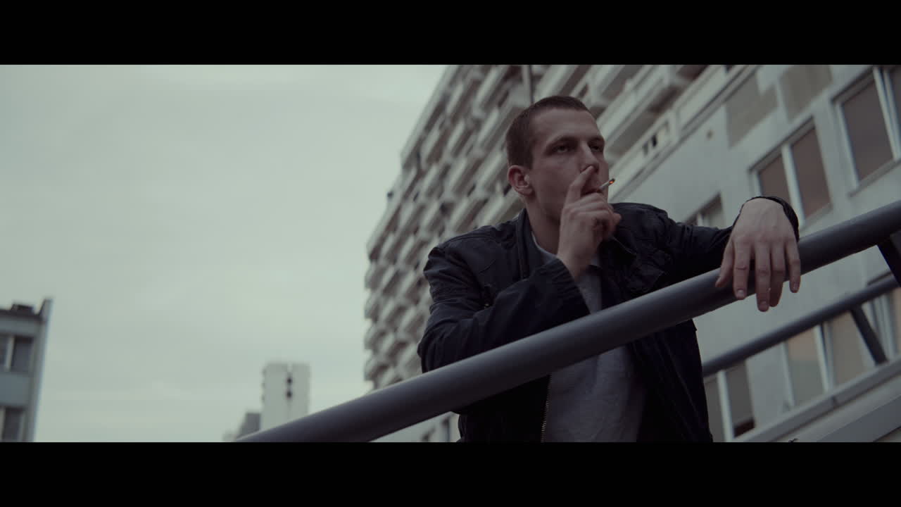 Young Man Smoking in the City