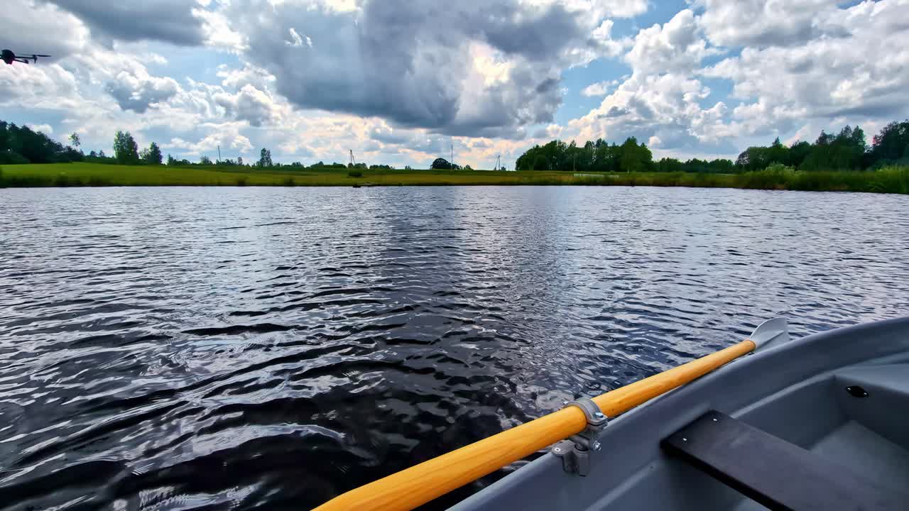 Point of view of paddling a kayak on a slow flowing river during a hot afternoon. Summer Sports. rowing canoe