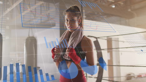 fitness data analytics animation over woman in boxing gym holding towel