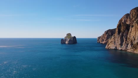 Sensational-aerial-view-of-Sea-Stack-of-Masua-in-Sardinia,-sunny-summer-day