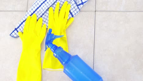 Yellow-rubber-gloves-and-spray-bottle