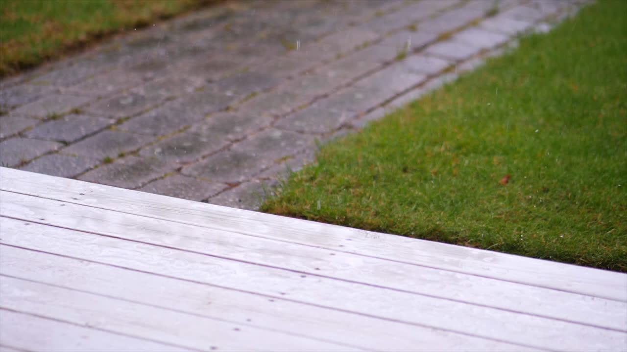 rain drops slowling dripping on porch