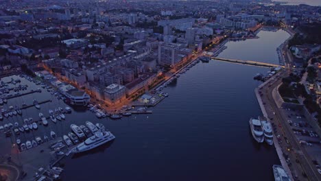 Harbor-with-boats-in-Zadar-city-during-early-morning-scene,-aerial