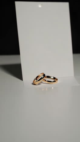 gold wedding rings on white background