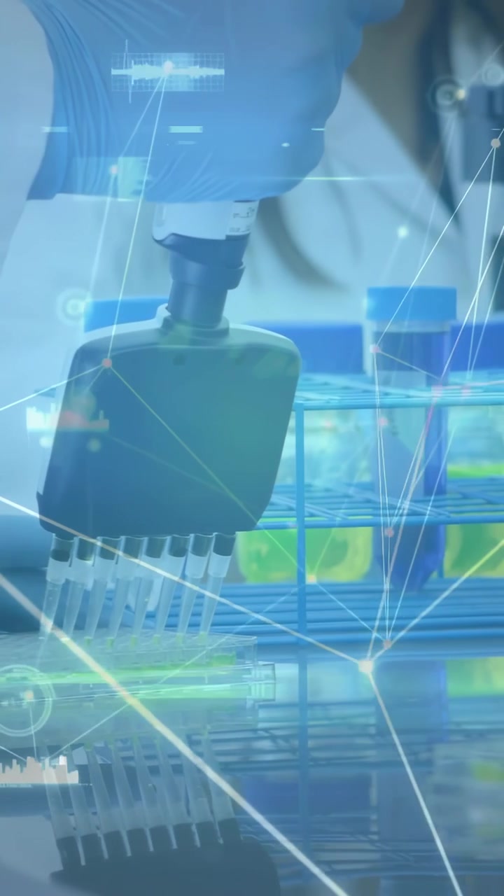 Vertical video: Gloved hand lowering pipette starting transfer across wells for analysis