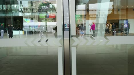 people entering and exiting melbourne museum entrance