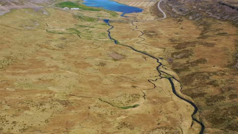 nice aerial of vast landscapes rivers and fjords in the westfjords of iceland