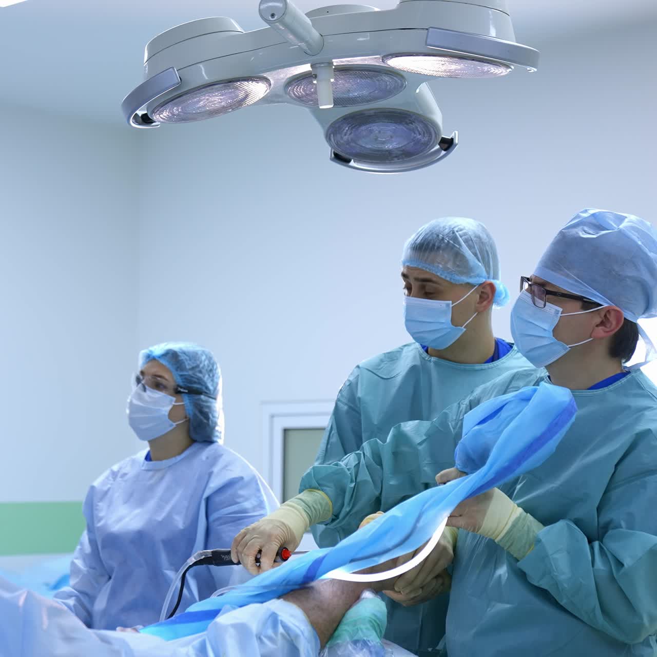 Modern equipment in operating room. Medical team performing operation