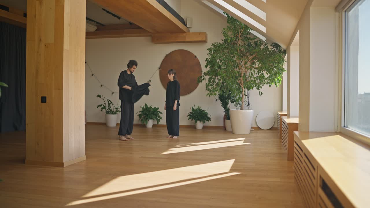 People in a Bright Room with Plants