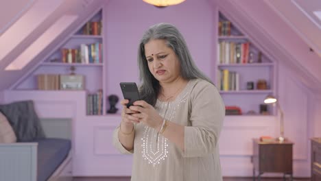 Angry-Indian-old-woman-chatting-on-phone