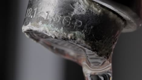 plumbing issue: crusty limescale on tap close up