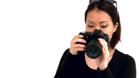 asian woman using professional camera