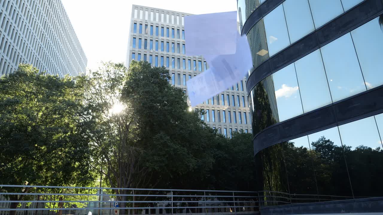Modern office buildings and green trees