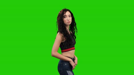 sad caucasian woman with long curly hair turns on green screen