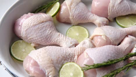 raw chicken legs with lime and rosemary