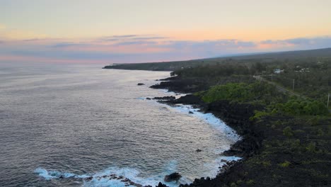 Sunset-illuminates-hundred-year-old-lava-fields-being-eroded-by-waves