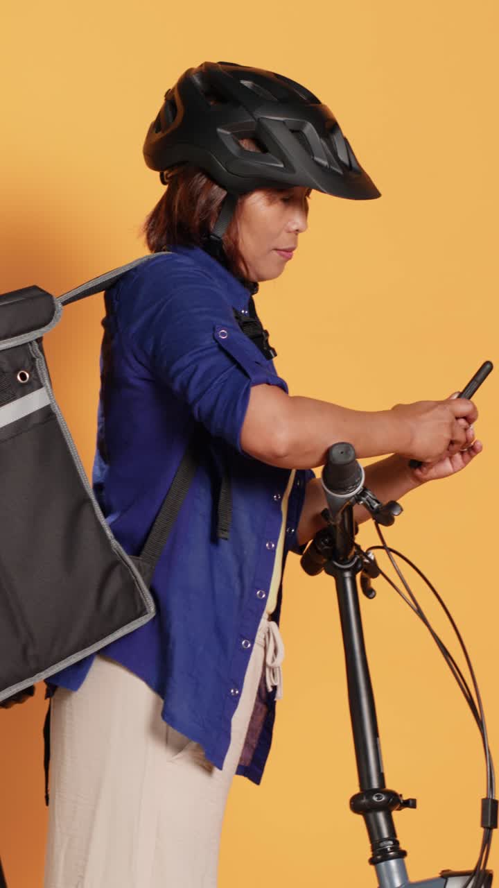 Woman with bicycle ready for food delivery