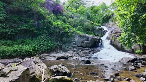 Panorama-movement-about-the-Grande-Cascade-waterfalls-and-its-environment,-Mortain,-France