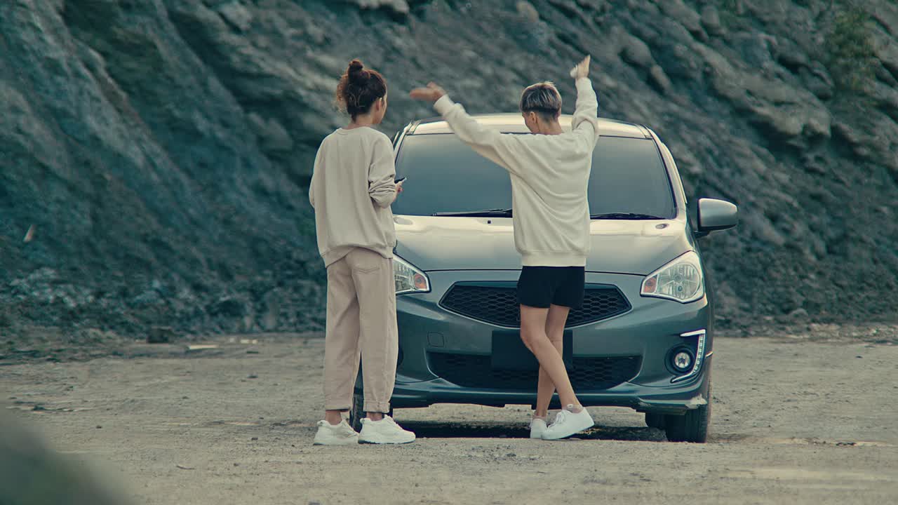 Two Women Deal with a Car Breakdown and Take Selfies During a Road Trip