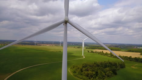 aerial of a field of wind turbines generating renewable energy on a wind farm