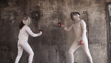 two fencers in action