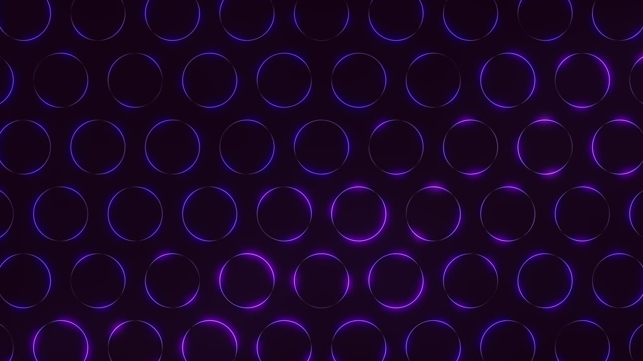 A mesmerizing pattern of bright purple glowing circles arranged in a circular formation on a sleek black background. An enchanting and captivating visual display