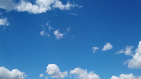 Time-Lapse-of-White-Fluffy-Cumulus-Clouds-Forming-contrasted-with-a-Perfect-Blue-Sky