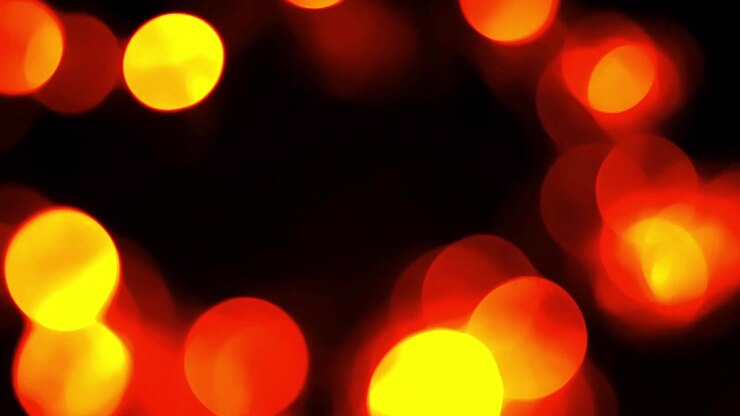 Sfondo astratto di luci bokeh rosse e arancioni luminose