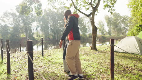 Camping,-happy-and-couple-hug-in-nature-walking