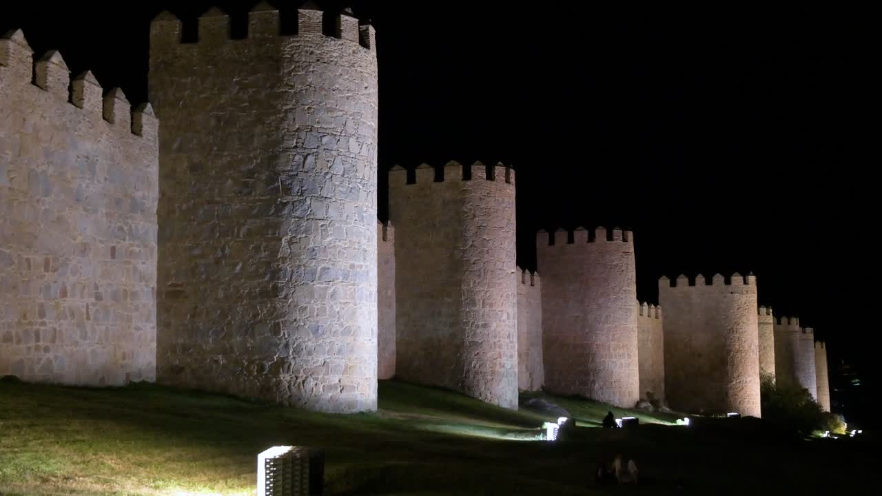 Avila’s ancient old town under the stars, with its UNESCO-listed medieval walls glowing in Spain.