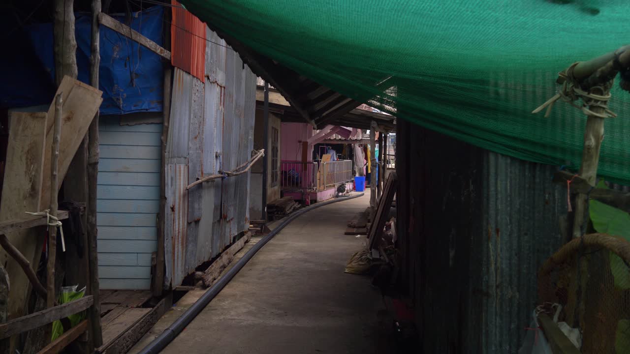 Narrow Passage Through The Muslim Fishing Village On The Island Of Koh Panyee, Phang Nga Province, Thailand. Static Shot