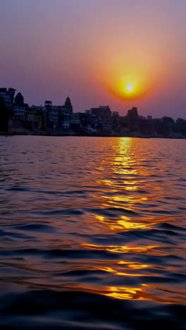 golden sunset reflection on the ganges river in varanasi
