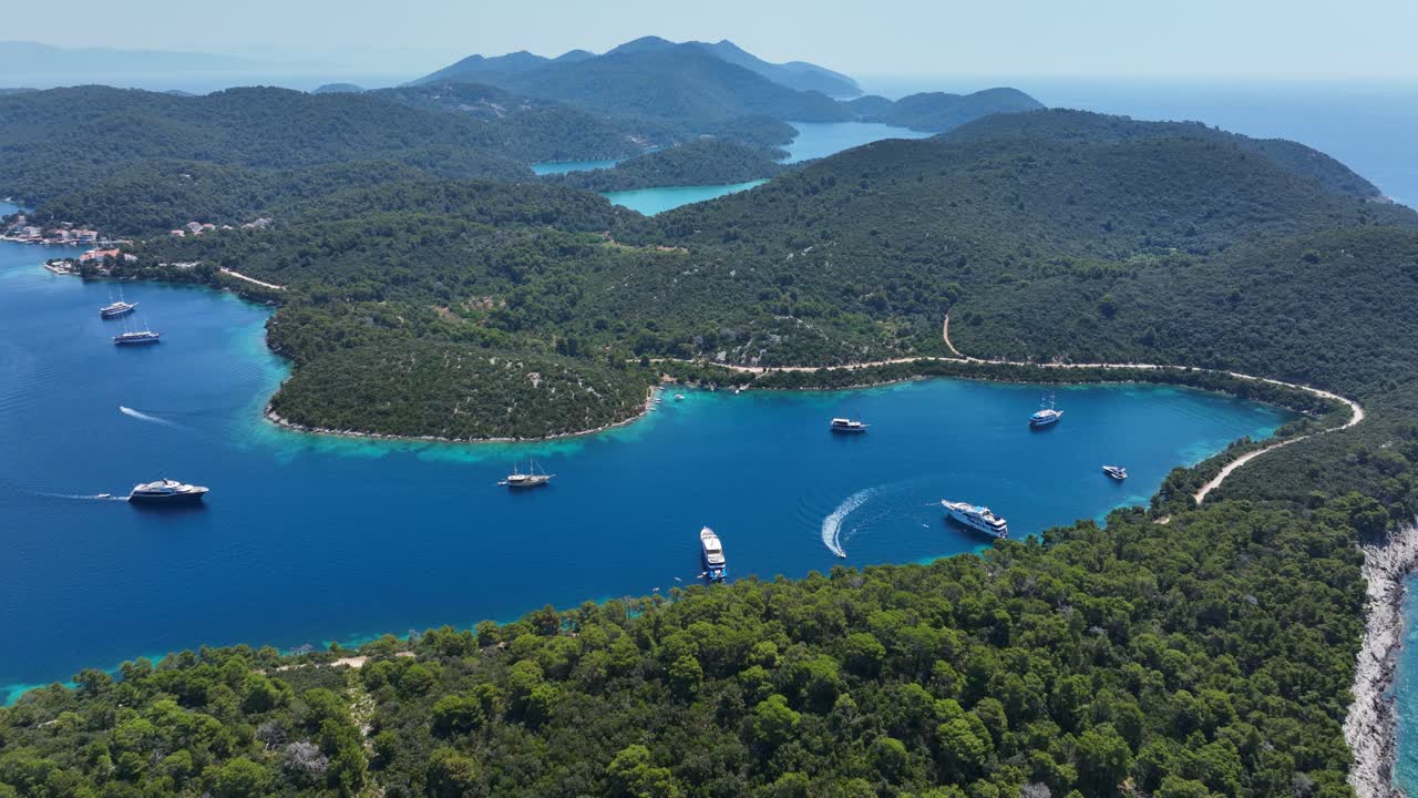 Stunning aerial shot of Mljet island showcasing yachts anchored along the pristine coastline
