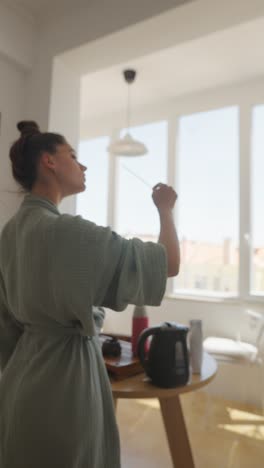 woman making tea at home