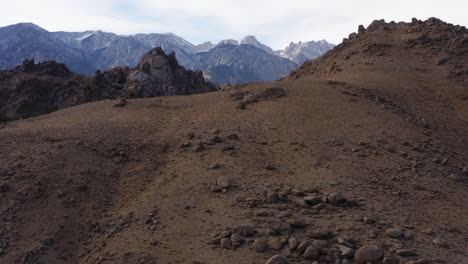 Aerial-Over-Dry-Hillside-With-Epic-Mountain-Views-Of-Eastern-Sierra-In-Distance